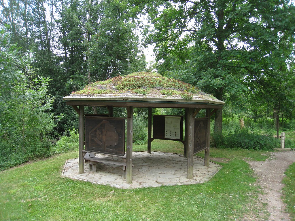 Matthaei Botanical Gardens 2010 0440.jpg - A shelter on the trail which has a sod roof with flowers planted on it.